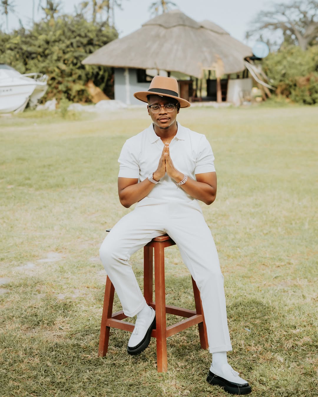 Drimo Papi seated outdoors